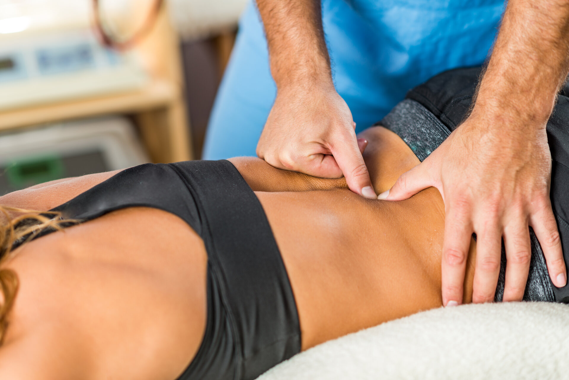 Physiotherapist massaging patient